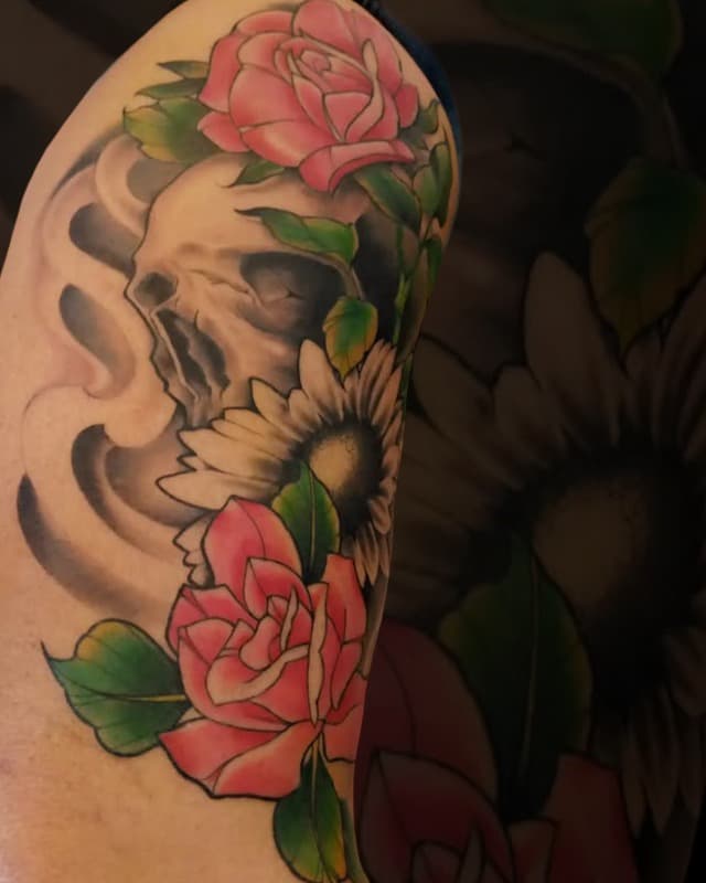 Color floral arm tattoo